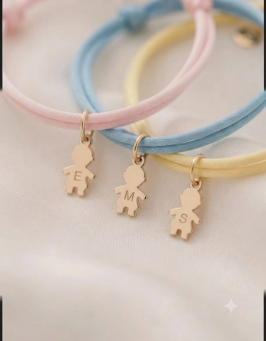 BRACCIALE E COLLANA IN TESSUTO CON CHARMS