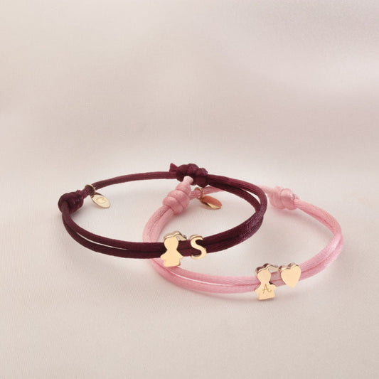 BRACCIALE E COLLANA IN TESSUTO CON CHARMS
