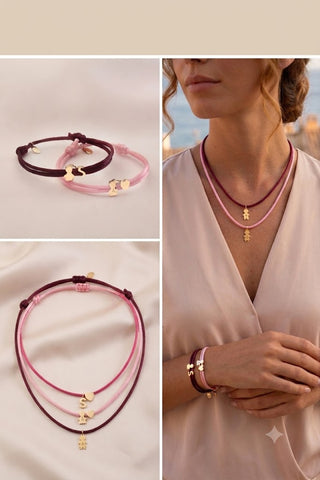 BRACCIALE E COLLANA IN TESSUTO CON CHARMS