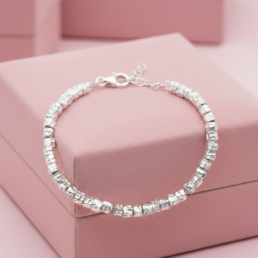 BRACCIALE CON PEPITE E PENDENTI