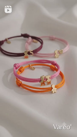 BRACCIALE E COLLANA IN TESSUTO CON CHARMS
